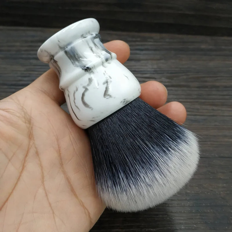 Shaving brush with marble-effect resin handle