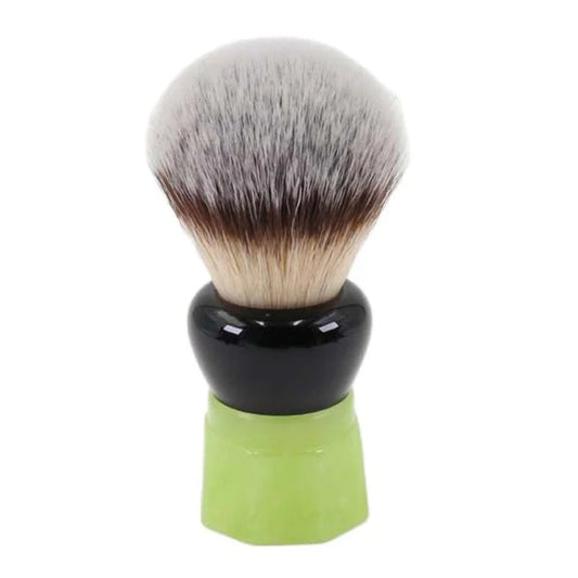 Modern shaving brush with soft bristles and a light green resin handle with a glossy black finish